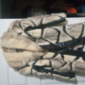 A coat size small medium brown leather and beige and brown Fair